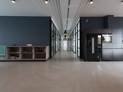 Painter applying primer to wall surface